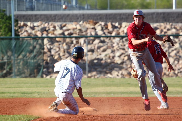 Liberty’s Jay Martz tries to turn a double play in the sixth inning after forcing Spri ...