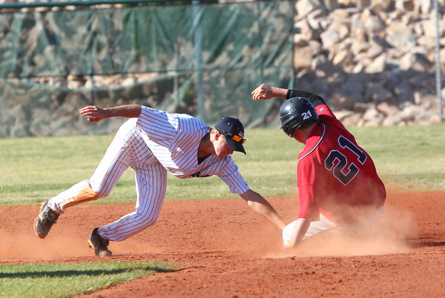 Liberty’s Braedon Billiu (21) is tagged out at second base by Spring Valley’s Za ...