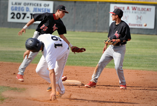 Las Vegas’ Hector Perez (26) and Mikel Smith miss the throw as Shadow Ridge’s Jo ...