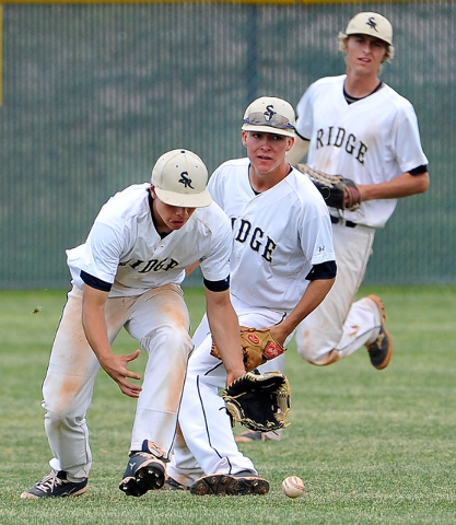Shadow Ridge’s Jakob Chambers, left, Tyler Burton and Travis Caskie line up to grab th ...