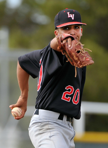 Las Vegas pitcher Jamie Solis turns to attempt to pick off a Shadow Ridge runner on Tuesday. ...