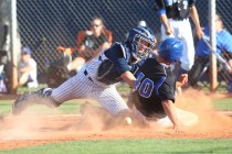Basic’s Isaac Perez (40) slides into home plate as Chatsworth catcher Jake Ryan loses ...
