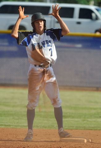 Basic’s Mikey York gestures after sliding safely into second base against Liberty on M ...