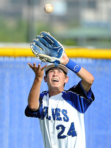 Basic right fielder Taylor Ferdinand catches a fly ball off the bat of Liberty’s Nick ...