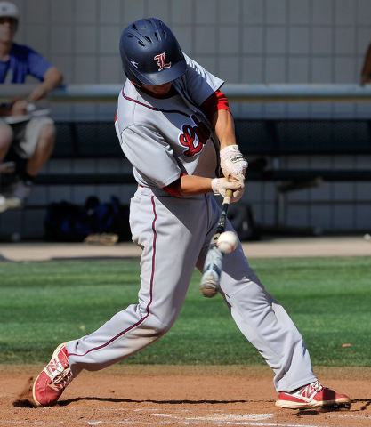 Liberty’s Ethan Ibarra connects with the ball against Basic on Monday. Basic won, 9-1. ...