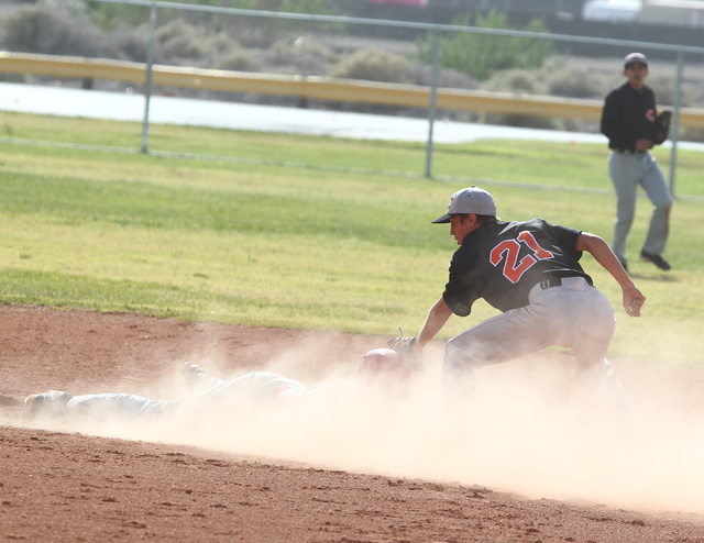 Chaparral’s Chad Clark (21) tries to tag out Tech’s Jalen Birch (14) at second ...