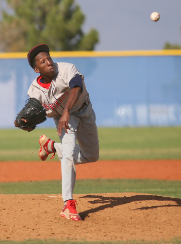 Coronado’s Donte Glover pitches and his hat lifts in the wind during a baseball game a ...