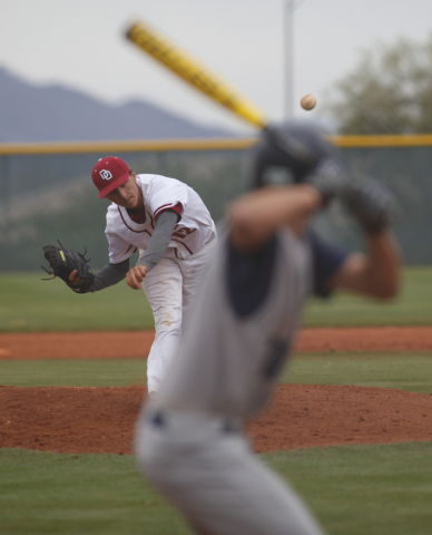 Desert Oasis’ Austin Strong (12) delivers a pitch during Saturday’s game against ...