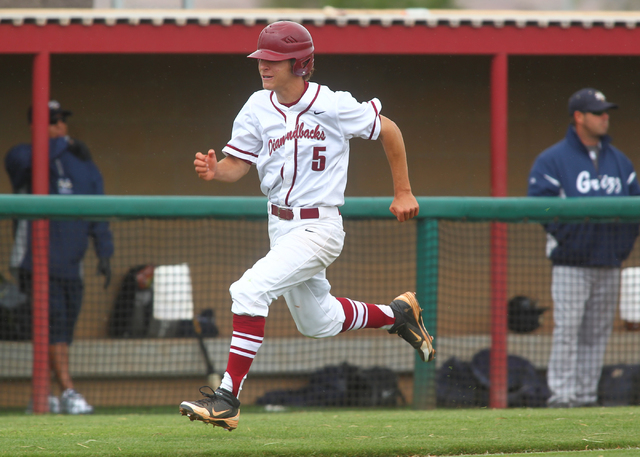 Desert Oasis’ Dominic Paratore scores one of his two runs in the Diamondbacks’ 7 ...