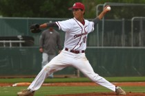 Desert Oasis’ Austin Strong (12) delivers a pitch in Saturday’s game against Spr ...