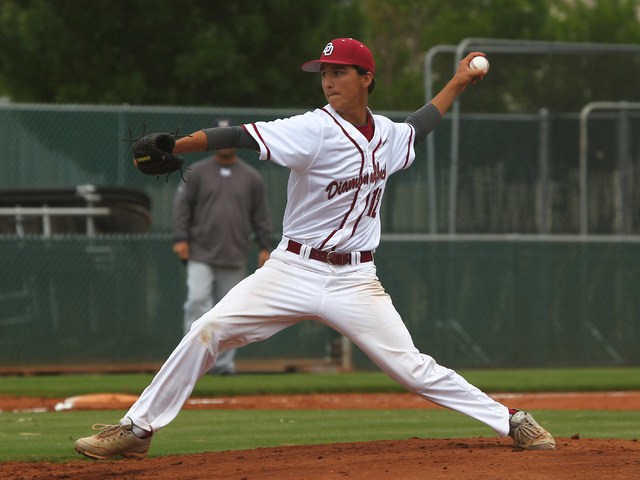 Desert Oasis’ Austin Strong (12) delivers a pitch in Saturday’s game against Spr ...