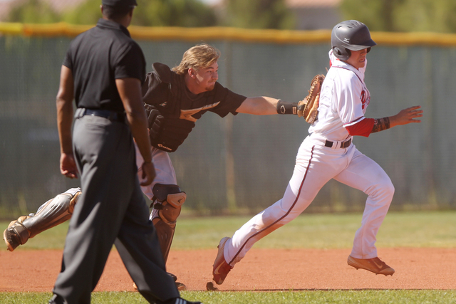 Liberty’s Nick Rush (5), right, is tagged out by Silverado’s catcher Vincent Tao ...