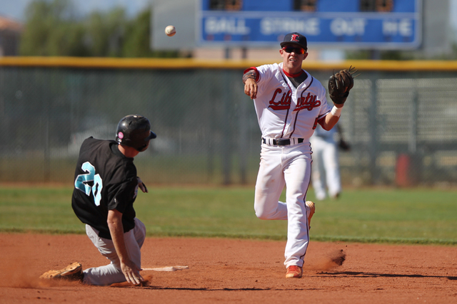 Liberty’s Nick Rush (5) throws to first base for a double play against Silverado in th ...