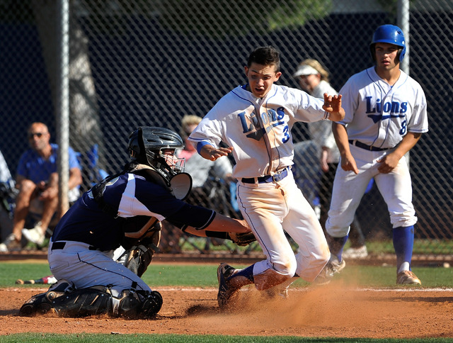 Shadow Ridge catcher Jordan Hand tags out Sierra Ridge’s Caeden Marin (3) at home pla ...