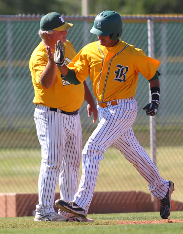 Rancho’s Jose Verdugo, right, high-fives coach Tom Pletsch following his two-run home ...