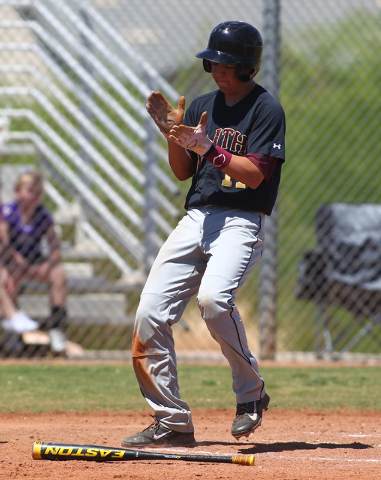 Faith Lutheran’s Chad Jones (7) celebrates after scoring a run against in the second i ...