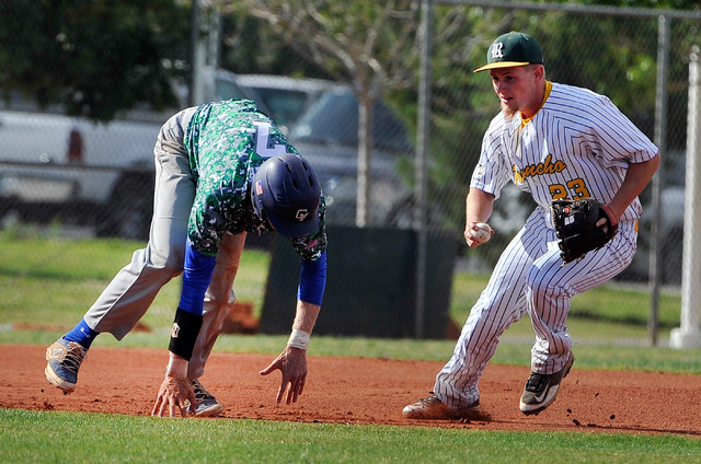 Green Valley’s Troy Cropper (7) looses his step as he is chased by Rancho’s Cody ...