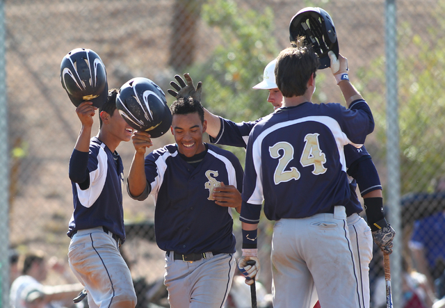 Shadow Ridge’s Eric Jordan, second from left, celebrates with teammates, including Bra ...