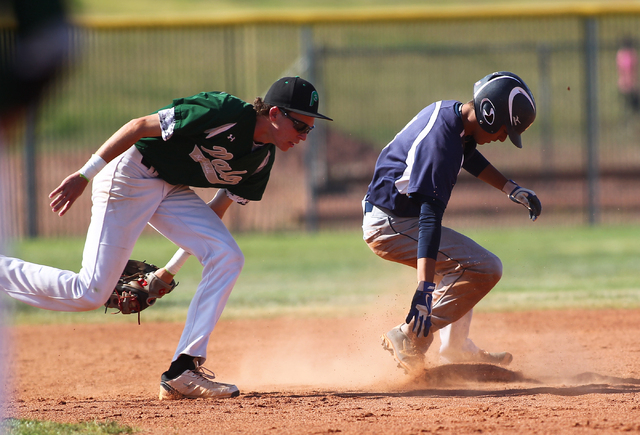 Shadow Ridge’s Robbie Galvan, right, slides safely into second base as Palo Verde&#821 ...