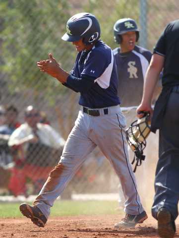 Shadow Ridge’s Robbie Galvan celebrates scoring a run against Palo Verde on Thursday. ...