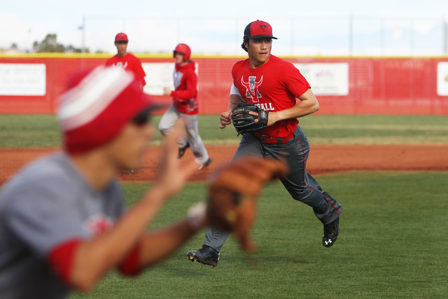 Arbor View short stop Nick Quintana takes part in a run down drill during practice Tuesday, ...