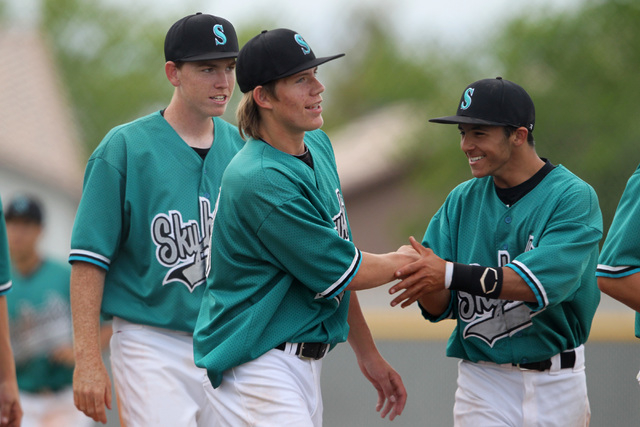 Silverado pitcher Buddie Pindel is congratulated after throwing a complete game in their 8-1 ...
