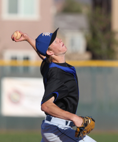 Basic pitcher Tanner Roundy throws to a Liberty batter during their game Thursday, March 19, ...