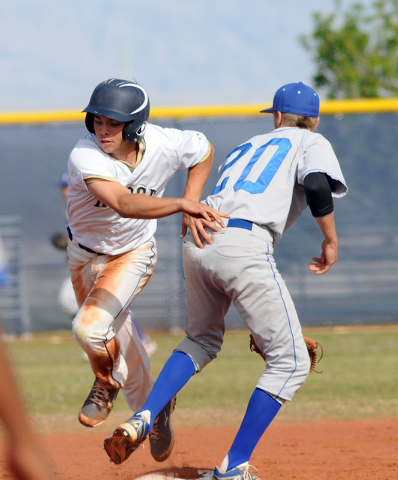 Shadow Ridge’s Jacob Chambers slips by Sierra Vista’s Chandler Smith at second a ...