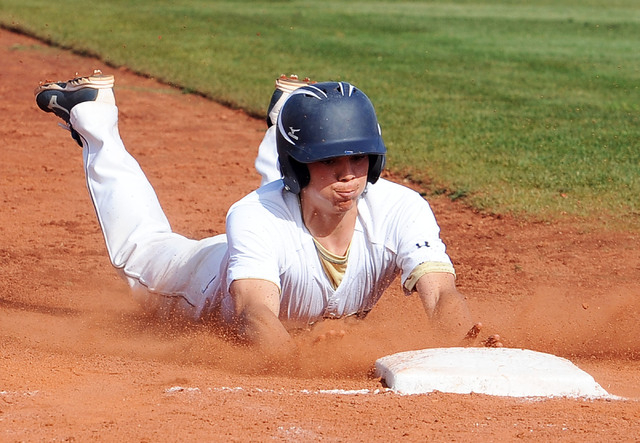 Shadow Ridge’s Jacob Chambers slides safely into third in the third inning on Thursay. ...