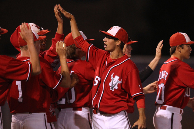 Arbor View pitcher Ben Cutting celebrates with teammates after defeating Green Valley during ...