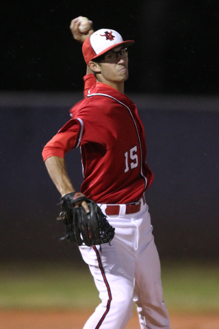 Arbor View pitcher Ben Cutting throws to first during their Division I baseball game against ...