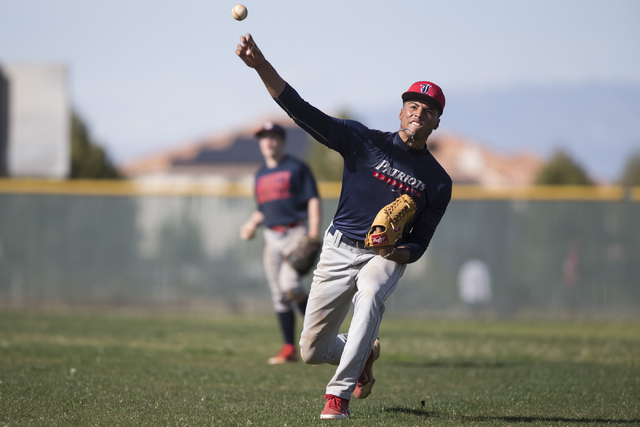 Liberty’s senior Ed O’Bannon throws the ball during a team practice at Liberty H ...