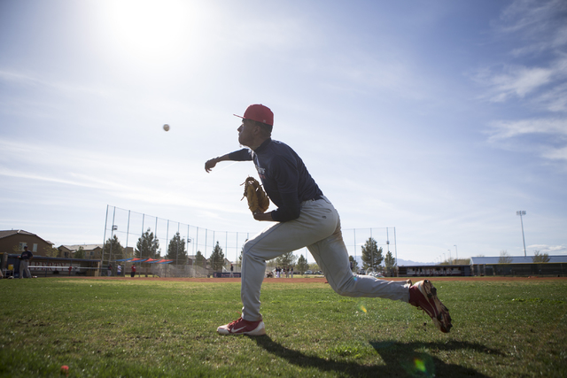 Liberty’s senior Ed O’Bannon throws the ball during a team practice at Liberty H ...