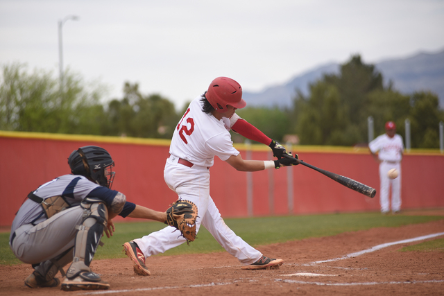 Arbor View’s Nick Quintana (12) hits a pitch against Shadow Ridge during their basebal ...