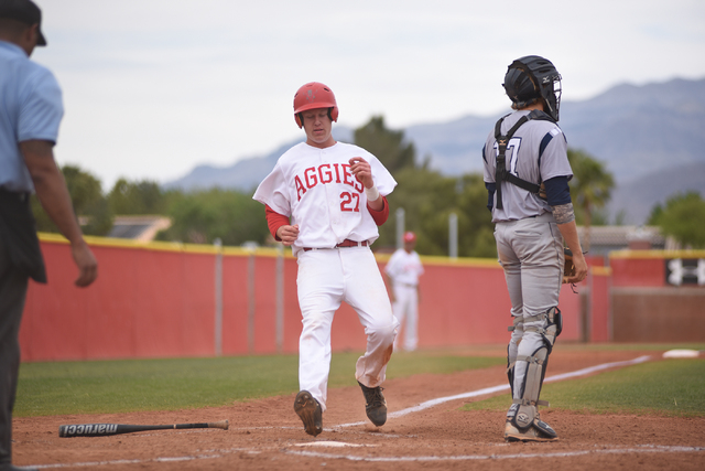 Arbor View’s Austin Pfeifer (27) scores a run against Shadow Ridge during their baseba ...