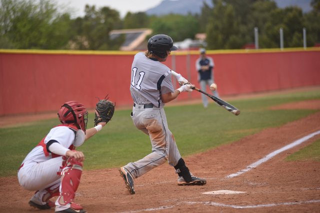 Shadow Ridge’s Quinn Ayers (11) swings at a pitch against Arbor View during their base ...