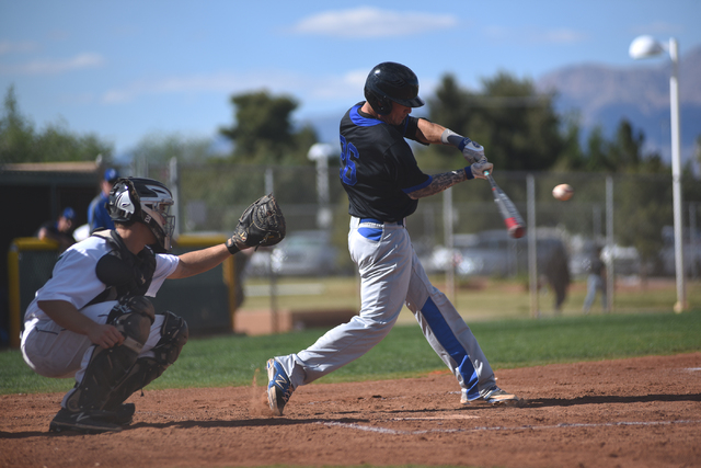 Basic’s Trent Bixby (26) swings at a pitch against Rancho during their baseball game p ...