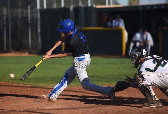 Basic’s Gehrig Timmons (6) swings at a pitch against Rancho during their baseball game ...