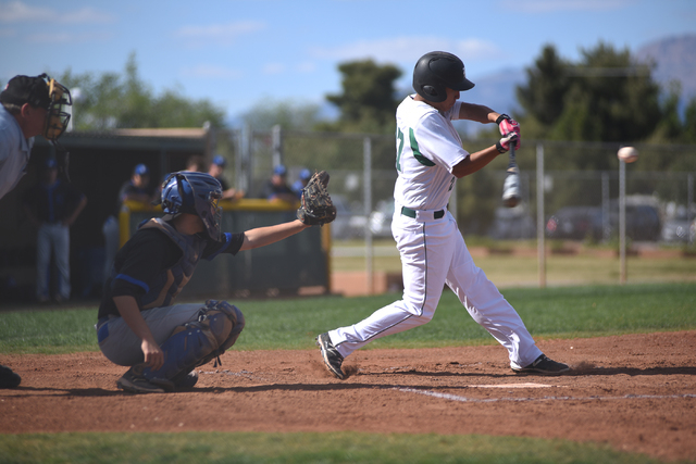 Rancho’s Anthony Guzman (27) swings at a pitch against Basic during their baseball gam ...