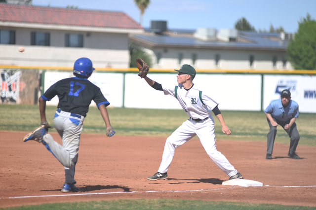 Rancho’s Anthony Becerra (2) catches an out at first base against Basic’s Garret ...