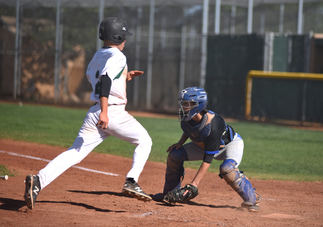 Rancho’s Anthony Becerra (2) scores a run against Basic during their baseball game pla ...