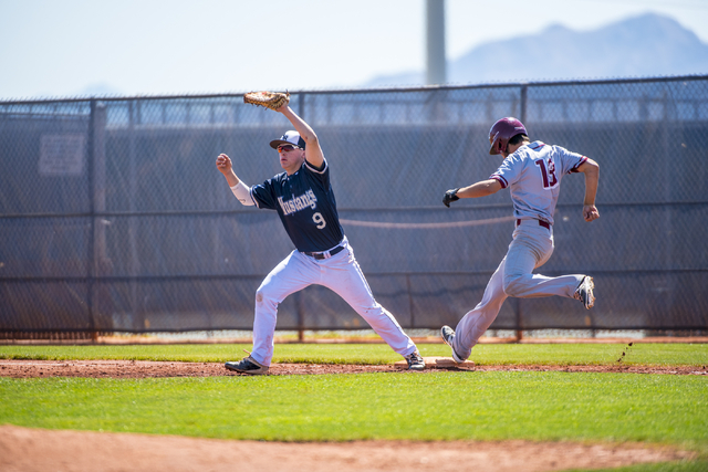 Shadow Ridge first baseman Justin Lee catches a ball as Desert Oasis outfielder Nic Lane run ...