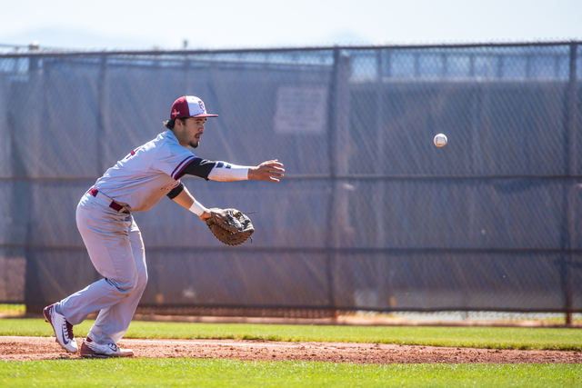 Desert Oasis first baseman Isaiah Raiano tosses the ball against Shadow Ridge at Shadow Ridg ...