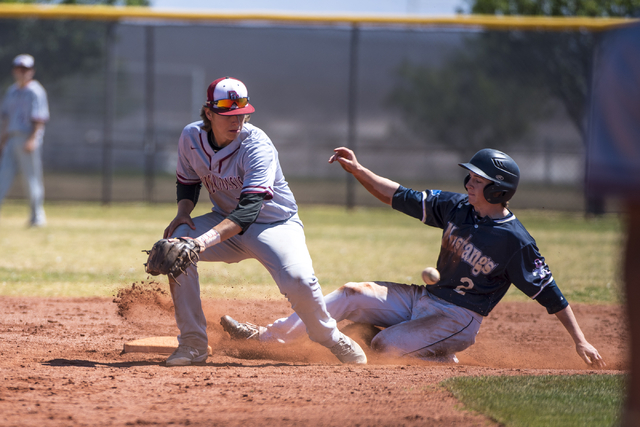 Shadow Ridge infielder Nick Erickson slides into second base as Desert Oasis shortstop Bryso ...