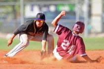 After driving in two runs, Cimarron-Memorial base runner Luis Flores is tagged out at second ...