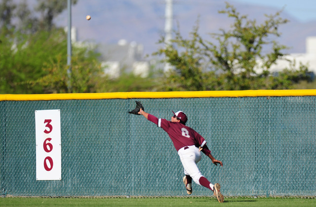 Cimarron-Memorial center fielder Jacob Godman makes a diving catch the fourth inning of thei ...
