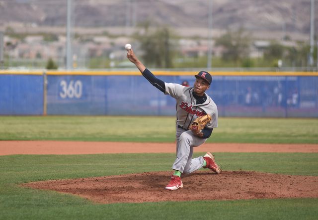 Liberty’s Ed O’Bannon (12) pitches against Basic during their baseball game play ...