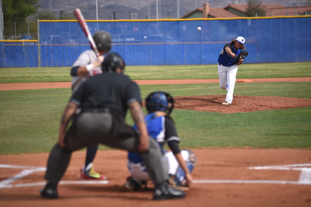 Basic’s Trevor Berg (11) pitches against Liberty during their baseball game played at ...