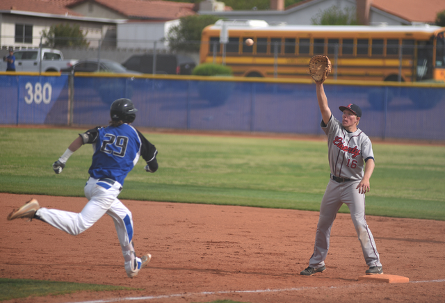 Liberty’s Justin Lutes (16) catches the ball for an out against Basic’s Ryne Nel ...