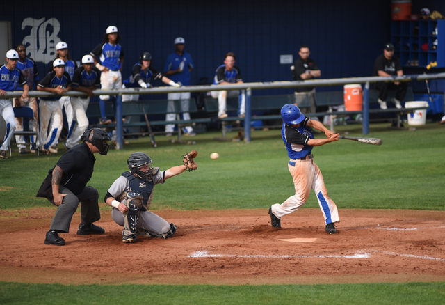 Basic’s Nick Thompson (55) swings at a strike against Liberty during their baseball ga ...